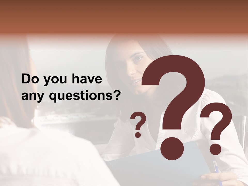 A Woman Sitting At A Desk Talking To Another Woman PowerPoint Template