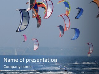 A Group Of Kites Being Flown Over The Ocean PowerPoint Template