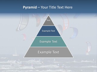 A Group Of Kites Being Flown Over The Ocean PowerPoint Template