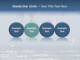 A Group Of Kites Being Flown Over The Ocean PowerPoint Template