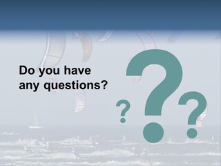 A Group Of Kites Being Flown Over The Ocean PowerPoint Template