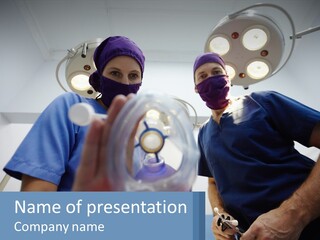 A Couple Of People In Scrubs Standing In A Room PowerPoint Template