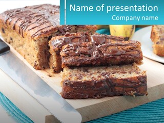 A Loaf Of Chocolate Chip Banana Bread On A Cutting Board PowerPoint Template