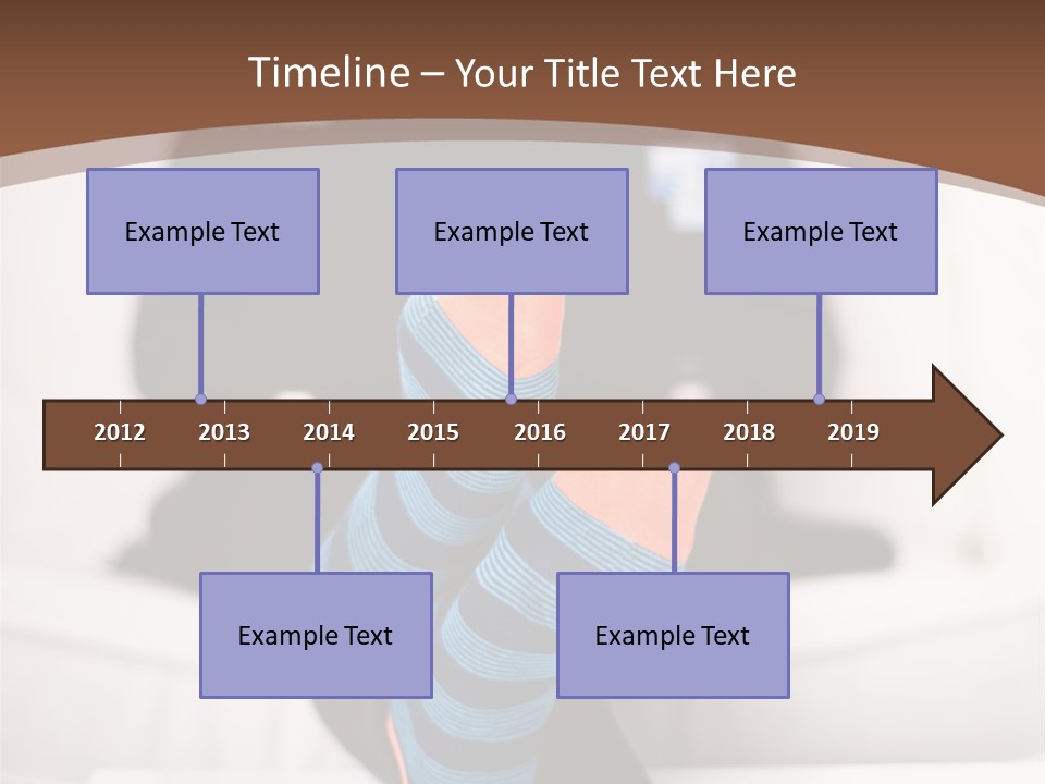 A Man Sitting In Front Of A Laptop Computer PowerPoint Template