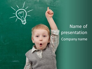 A Young Boy Pointing At A Light Bulb On A Chalkboard PowerPoint Template