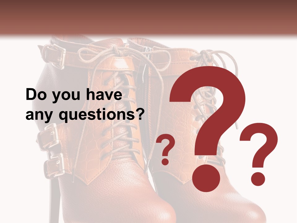 A Pair Of Brown Boots With Straps On Them PowerPoint Template