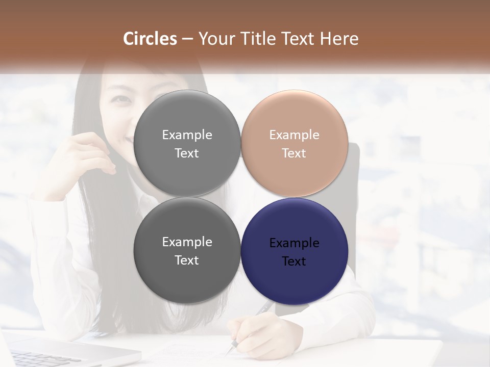 A Woman Sitting At A Desk In Front Of A Laptop Computer PowerPoint Template