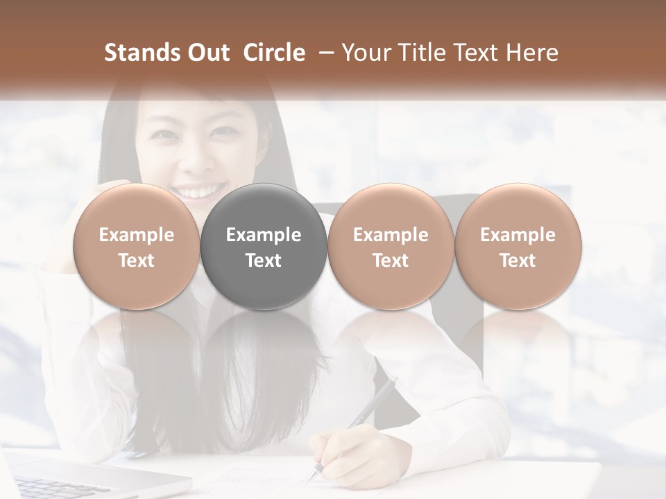 A Woman Sitting At A Desk In Front Of A Laptop Computer PowerPoint Template