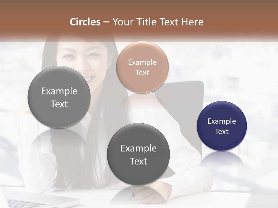 A Woman Sitting At A Desk In Front Of A Laptop Computer PowerPoint Template