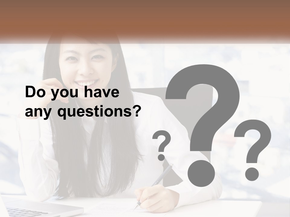 A Woman Sitting At A Desk In Front Of A Laptop Computer PowerPoint Template