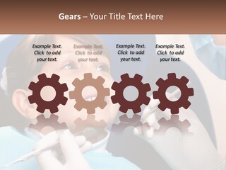 A Young Boy Getting His Teeth Checked By A Dentist PowerPoint Template