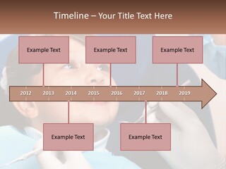A Young Boy Getting His Teeth Checked By A Dentist PowerPoint Template