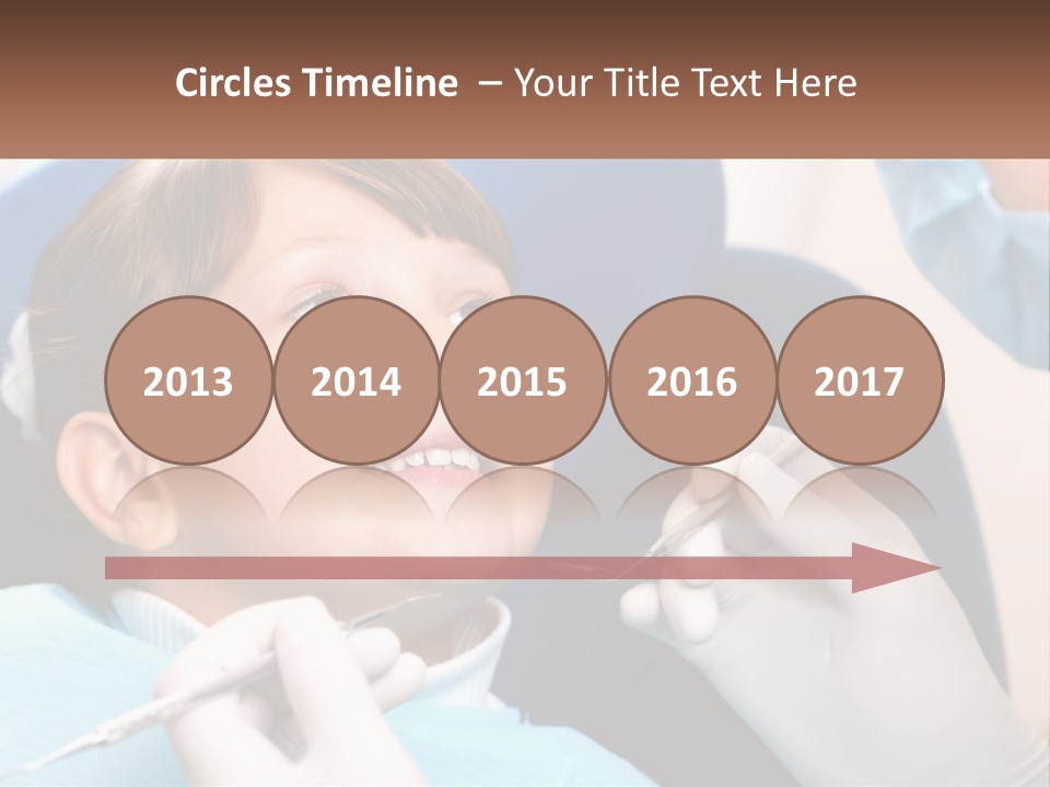 A Young Boy Getting His Teeth Checked By A Dentist PowerPoint Template