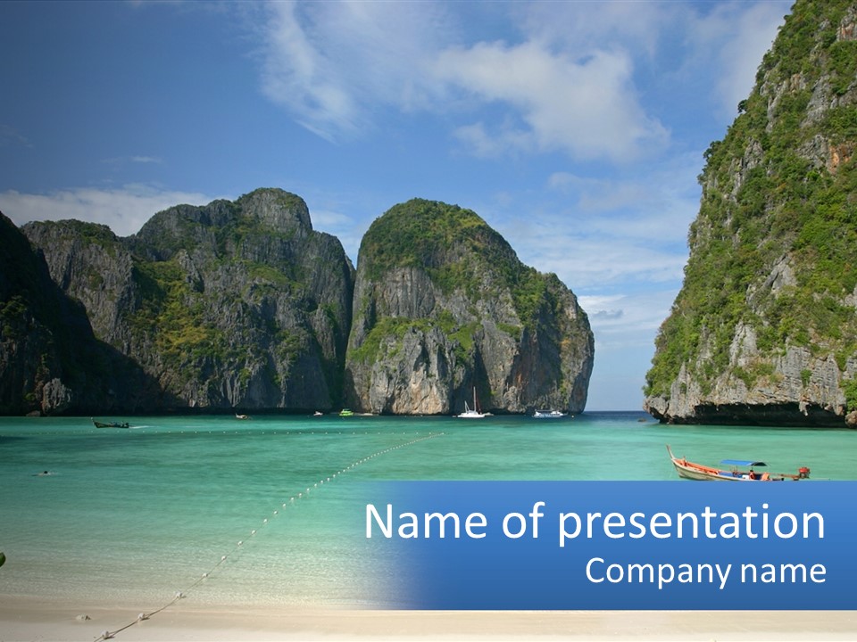 A Beach With A Boat In The Water And Mountains In The Background PowerPoint Template