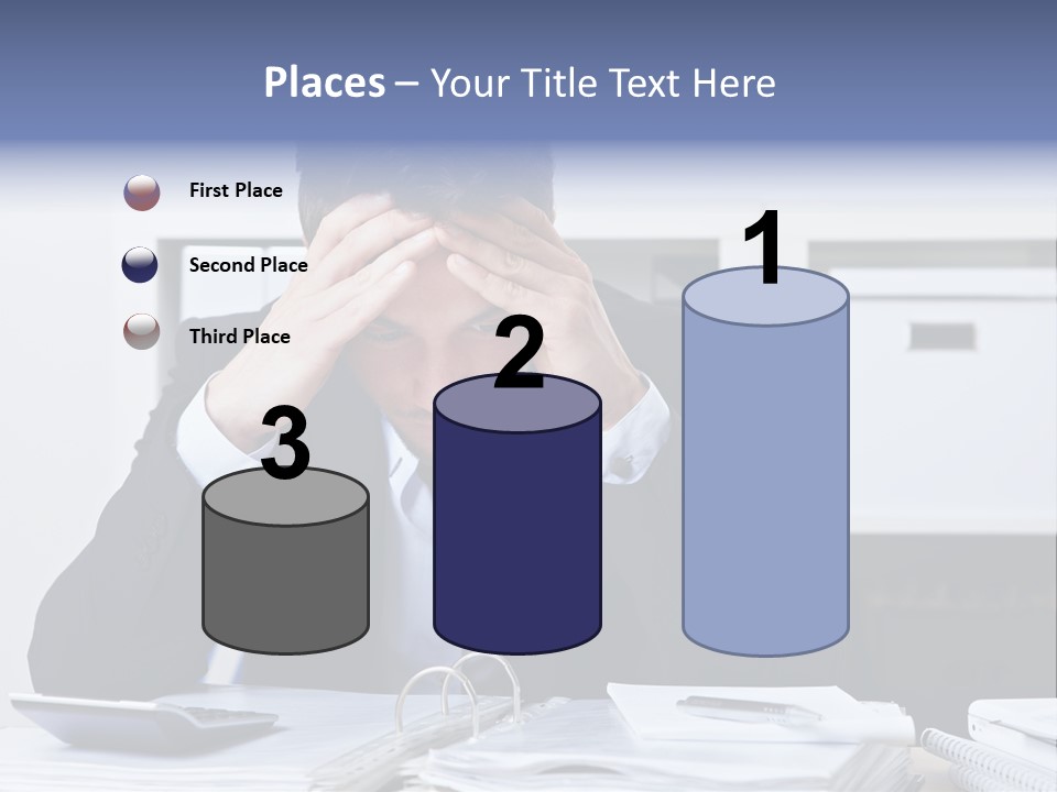 A Man Sitting At A Desk With His Hands On His Head PowerPoint Template