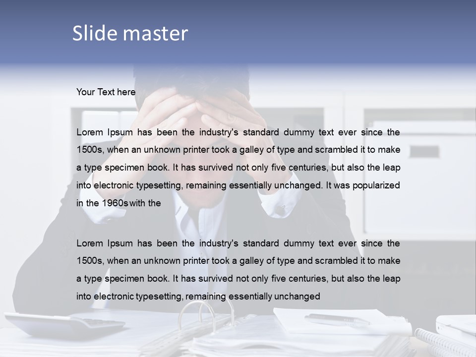 A Man Sitting At A Desk With His Hands On His Head PowerPoint Template