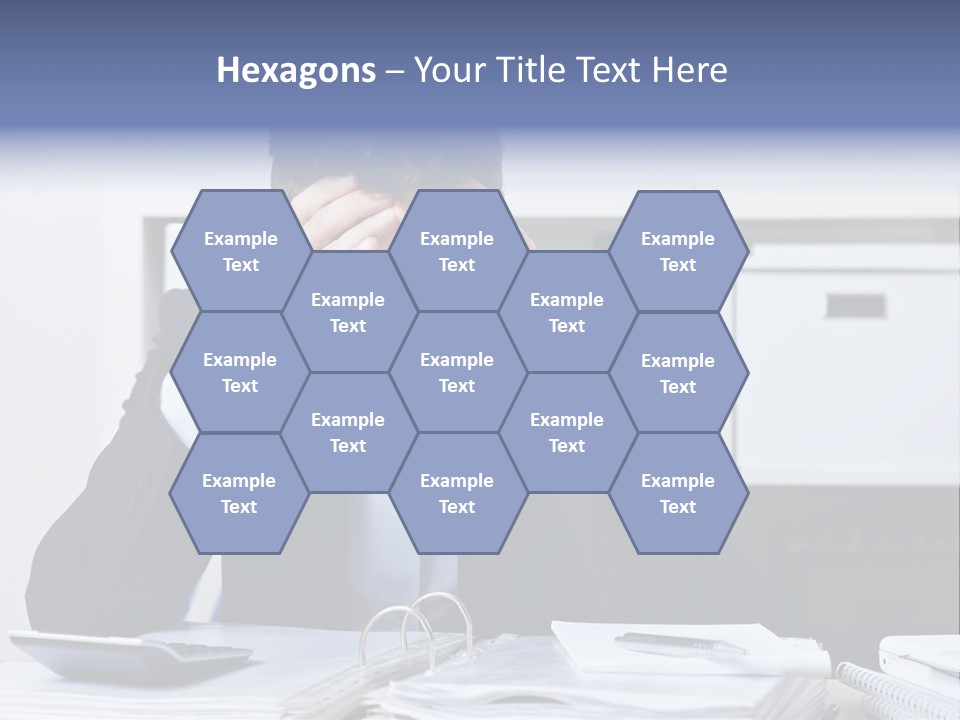 A Man Sitting At A Desk With His Hands On His Head PowerPoint Template