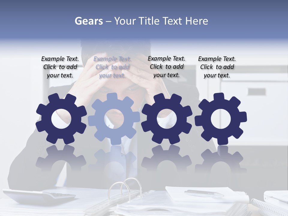 A Man Sitting At A Desk With His Hands On His Head PowerPoint Template