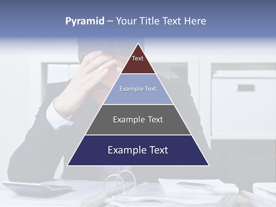 A Man Sitting At A Desk With His Hands On His Head PowerPoint Template
