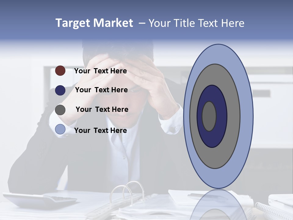 A Man Sitting At A Desk With His Hands On His Head PowerPoint Template