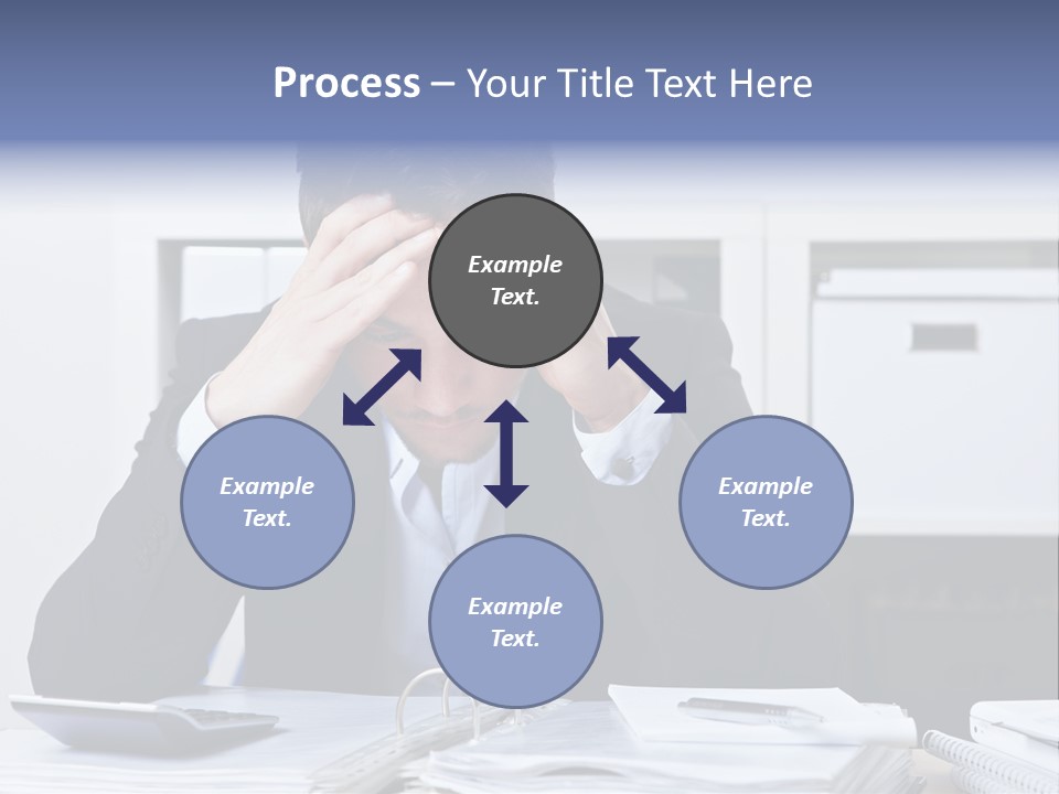 A Man Sitting At A Desk With His Hands On His Head PowerPoint Template