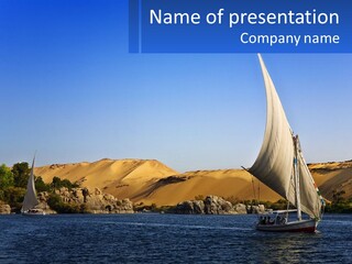 A Sailboat In The Middle Of A Body Of Water PowerPoint Template