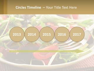 A Salad With Tomatoes And Lettuce On A Plate With A Fork PowerPoint Template