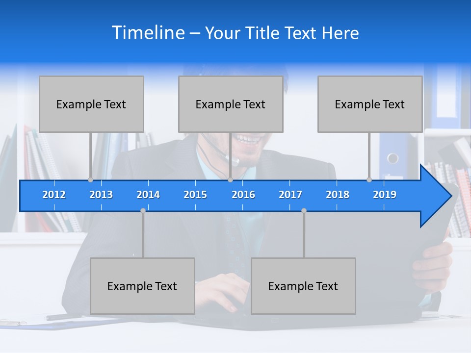 A Man Wearing A Headset And Using A Laptop PowerPoint Template