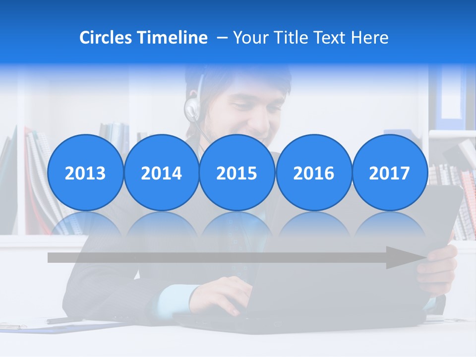 A Man Wearing A Headset And Using A Laptop PowerPoint Template