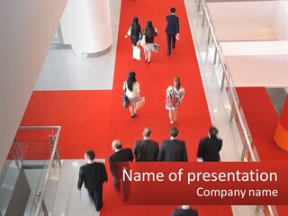 A Group Of People Walking Down A Red Carpeted Hallway PowerPoint Template