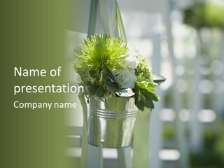 A Green And White Flower Arrangement In A Vase PowerPoint Template