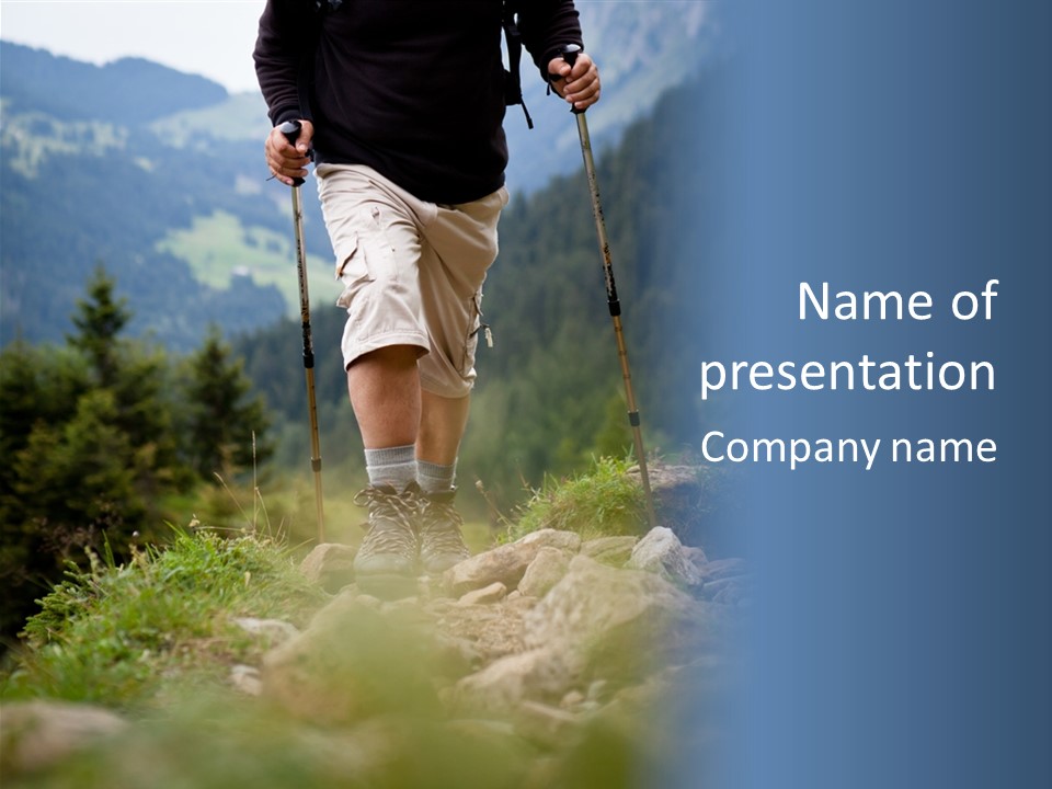 A Man Hiking Up A Hill In The Mountains PowerPoint Template