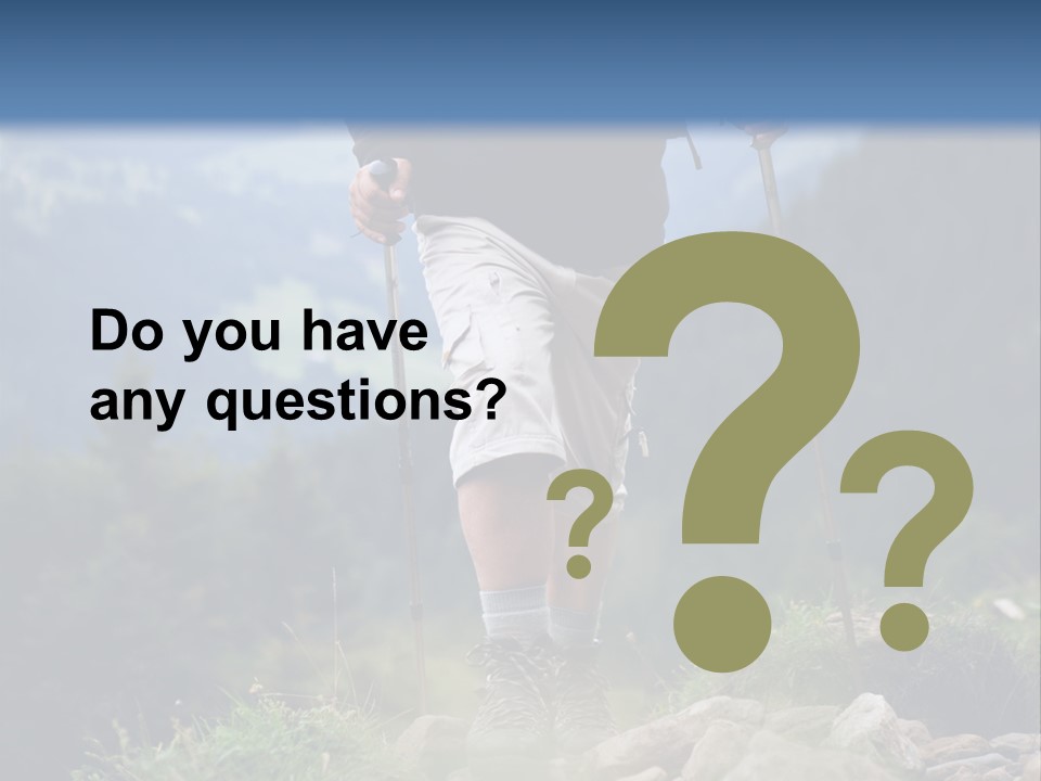 A Man Hiking Up A Hill In The Mountains PowerPoint Template