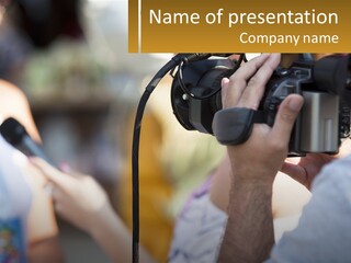 A Person Holding A Camera Up To Take A Picture PowerPoint Template