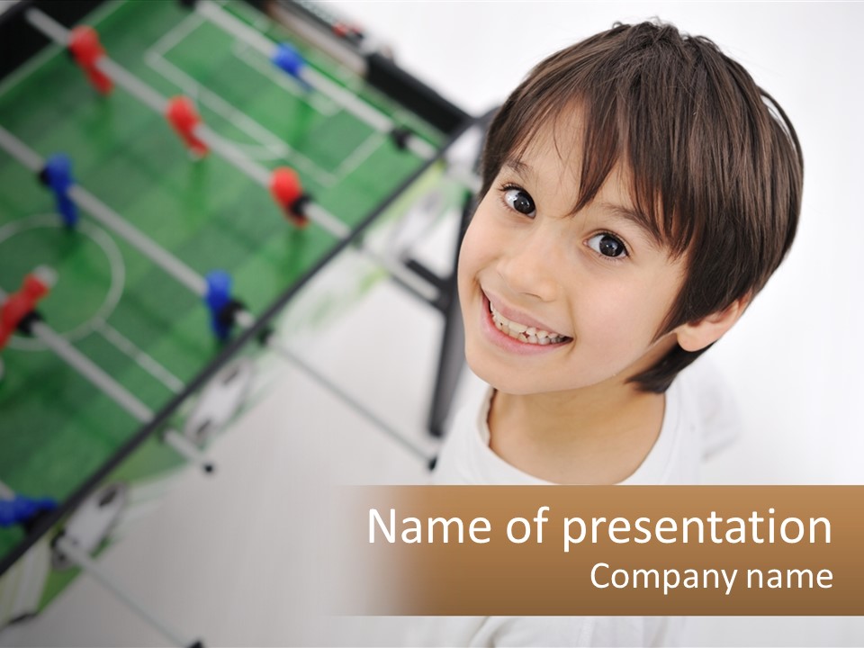 A Young Boy Standing In Front Of A Soccer Field PowerPoint Template