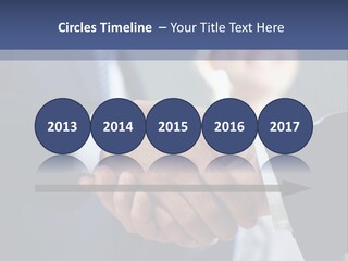 Two Men Shaking Hands In Front Of A Group Of People PowerPoint Template
