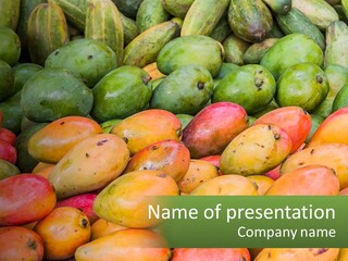 A Large Display Of Mangoes And Other Fruits PowerPoint Template