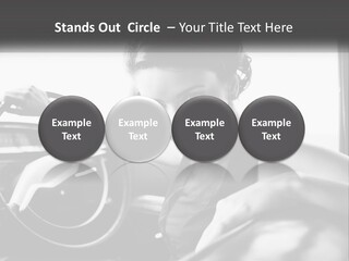 A Woman Sitting In A Car With Her Hand On The Steering Wheel PowerPoint Template