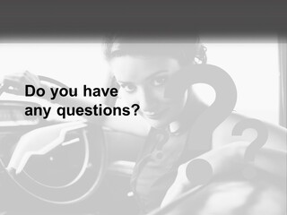 A Woman Sitting In A Car With Her Hand On The Steering Wheel PowerPoint Template