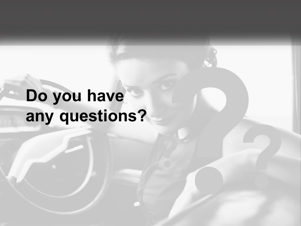 A Woman Sitting In A Car With Her Hand On The Steering Wheel PowerPoint Template