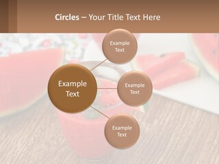 A Glass Of Watermelon Juice On A Table With Slices Of Watermelon PowerPoint Template