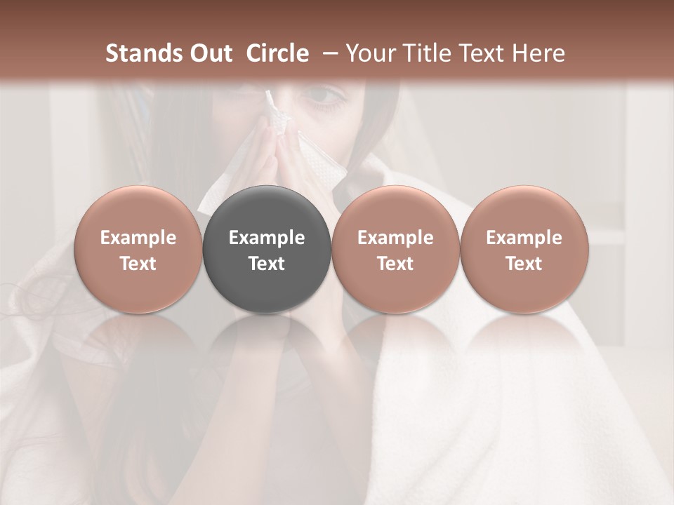 A Woman Wrapped In A Blanket Is Sitting On A Couch PowerPoint Template