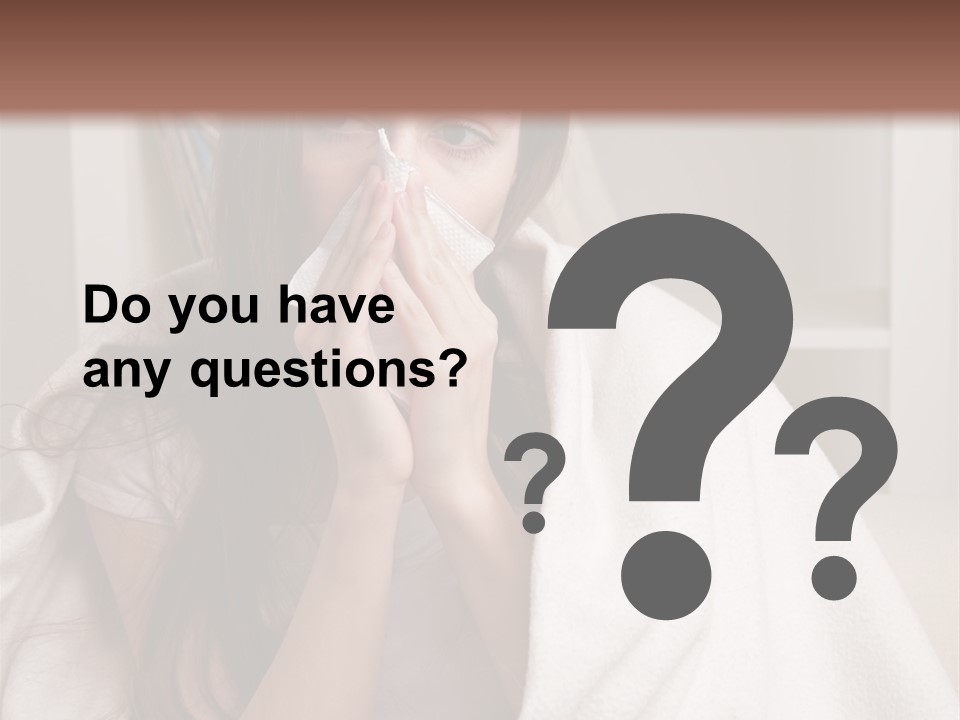 A Woman Wrapped In A Blanket Is Sitting On A Couch PowerPoint Template