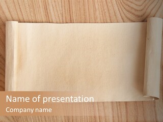 A Piece Of Paper On Top Of A Wooden Table PowerPoint Template