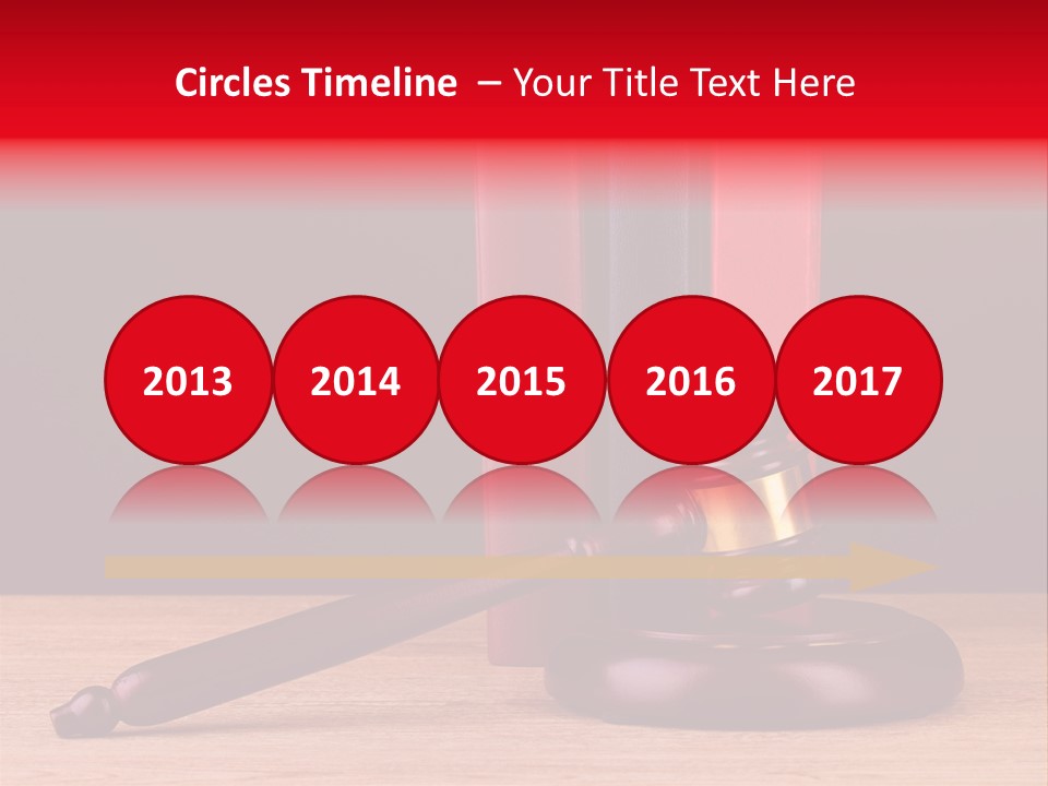 A Judge's Gaven Sitting On Top Of A Wooden Table PowerPoint Template