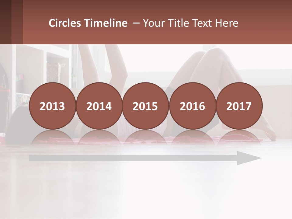 A Woman Laying On The Floor With A Dumbbell PowerPoint Template