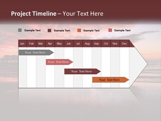 A Sunset Over The Ocean With A Pier In The Background PowerPoint Template