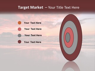 A Sunset Over The Ocean With A Pier In The Background PowerPoint Template