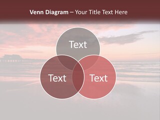 A Sunset Over The Ocean With A Pier In The Background PowerPoint Template