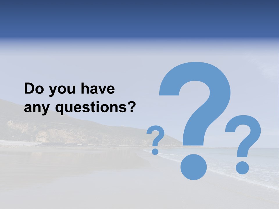 A Sandy Beach With A Hill In The Background PowerPoint Template